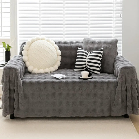 Cubre Sofá Piel de Conejo — Lujo suave que protege tu sofá.