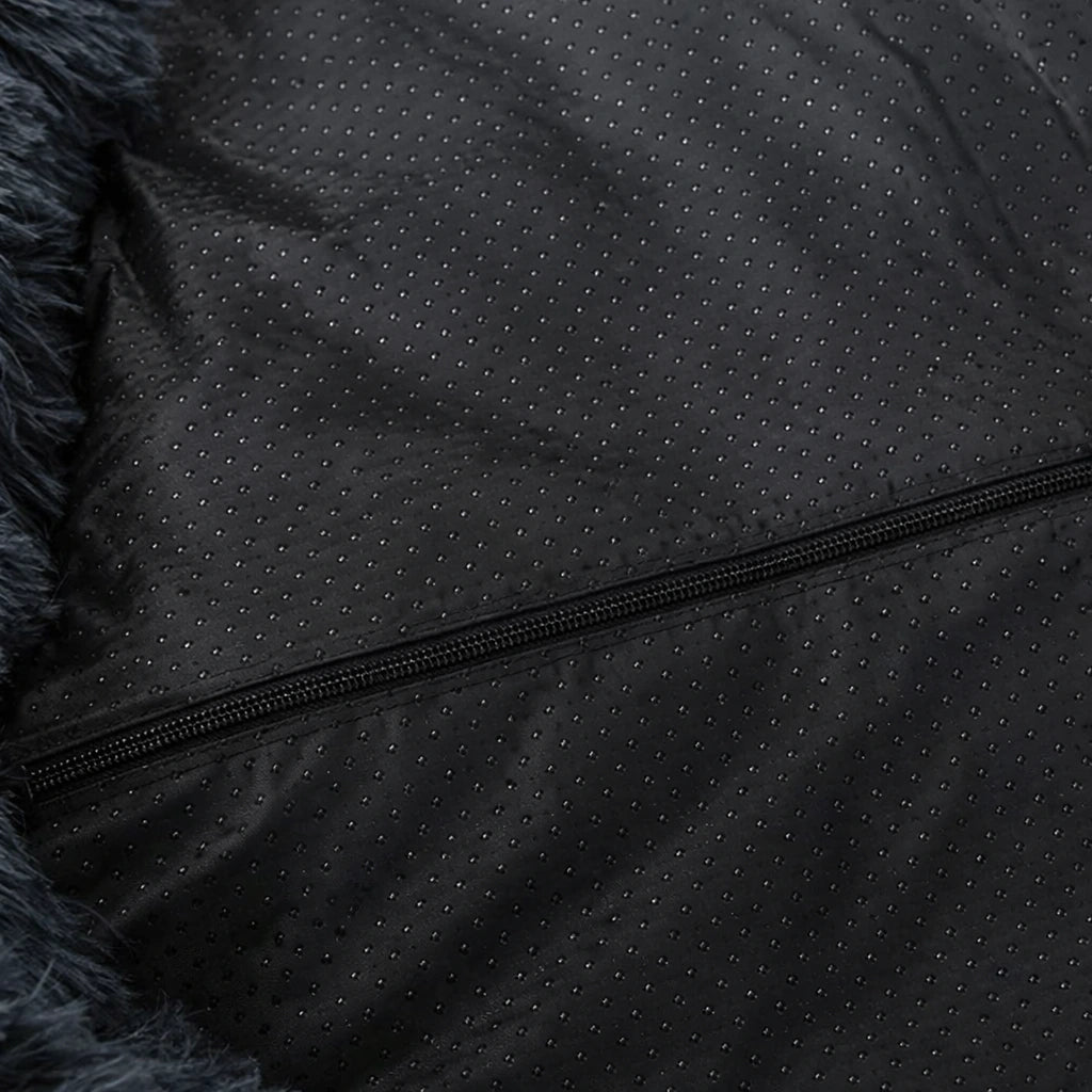 Cama anti-estrés THE DOGS dada vuelta mostrando la base completa.