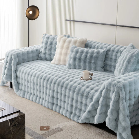 Cubre Sofá Piel de Conejo — Lujo suave que protege tu sofá.