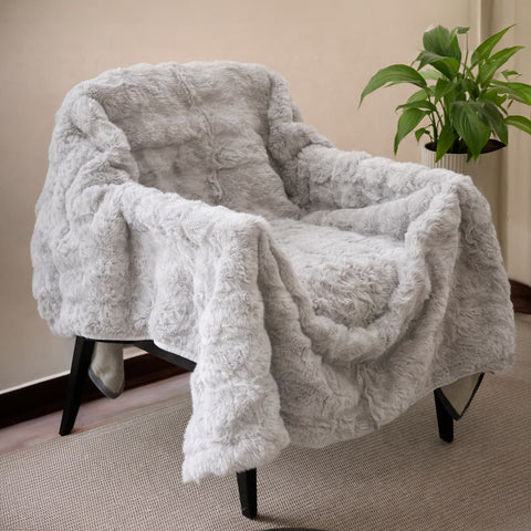 Cubre Sofá Piel de Conejo — Lujo suave que protege tu sofá.