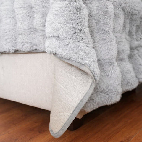 Cubre Sofá Piel de Conejo — Lujo suave que protege tu sofá.